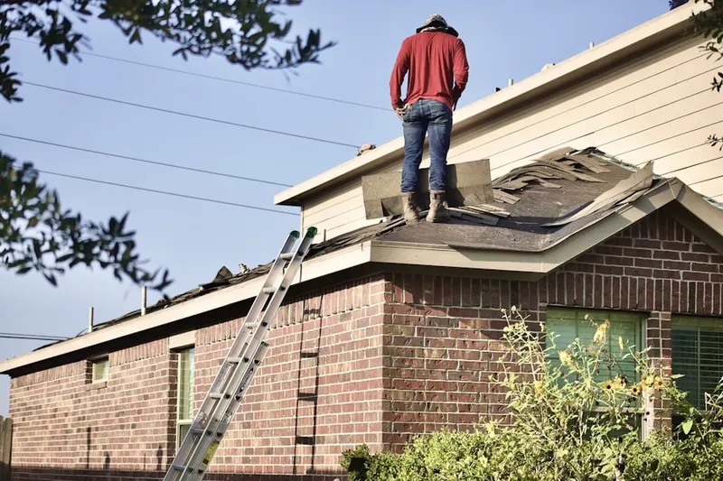Professional roofer working on a residential roof in Hercules